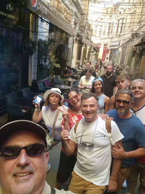 Bucharest: Walking tour with Italian speaking guide for small groups - Meeting at Caru’ cu Bere in the Old Town