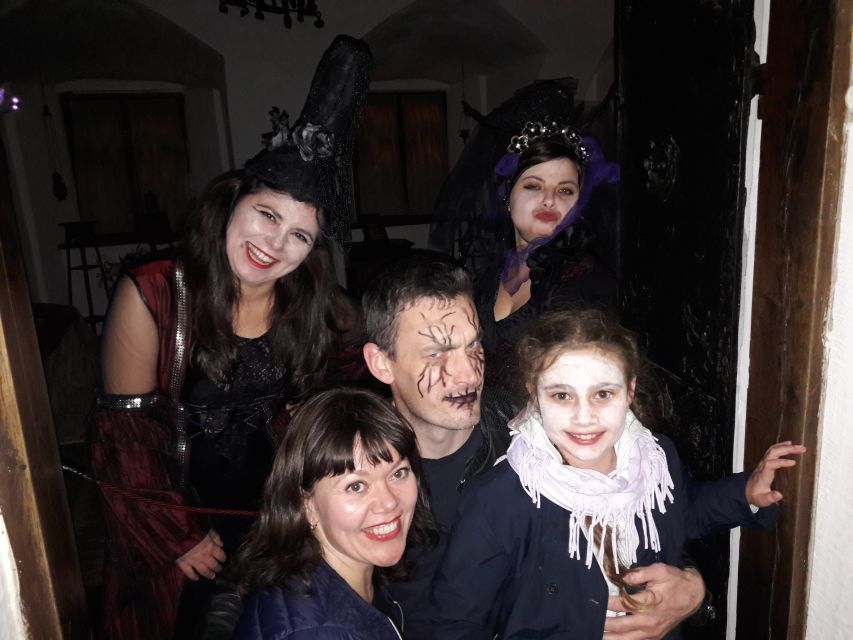 From Brasov: Halloween Party at Bran Castle - Red wine, palinca, and snacks in Bran village