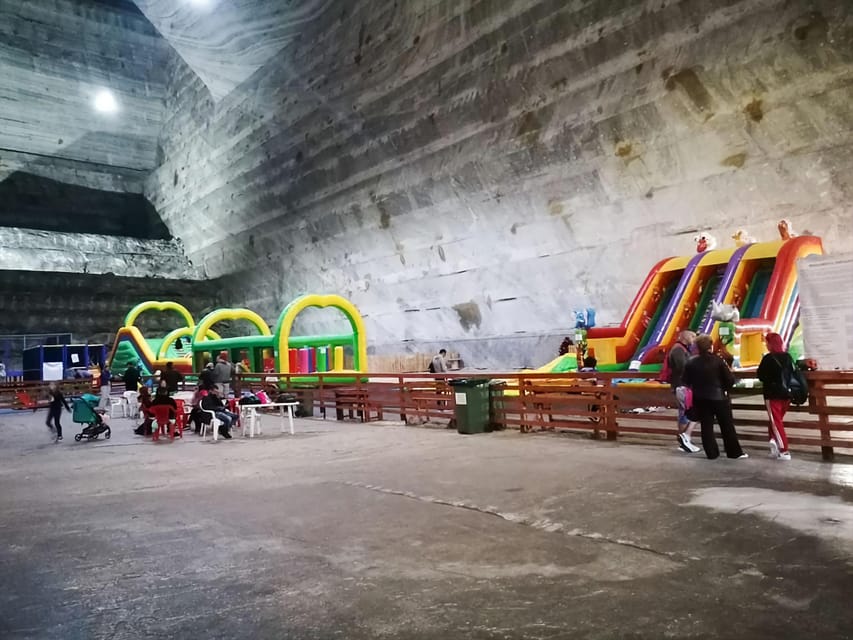 From Bucharest: Private Tour Salina Slanic: Salt Palace - The salt lake, waterfall, and wooden bridge